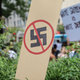 A anti-Nazi sign stands as counter protesters gather at Freedom Plaza before the Unite the Right rally in Lafayette Park on August 12, 2018 in Washington, DC.